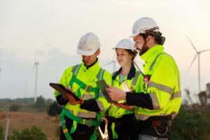 Engineer wearing safety uniform using tablet discussed plan about renewable energy