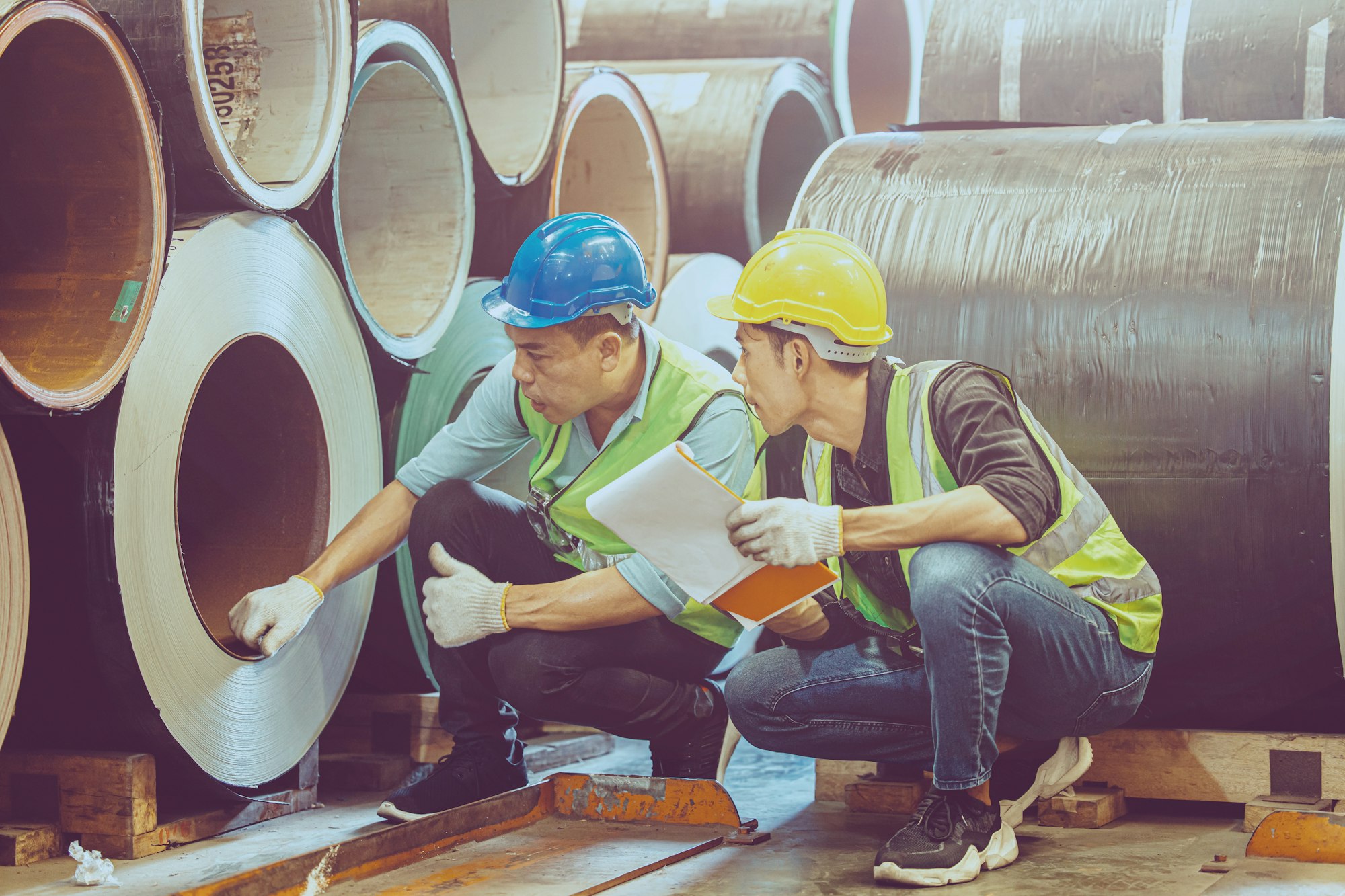 Heavy Industry Worker workman service team working in metal factory.Checking material resources